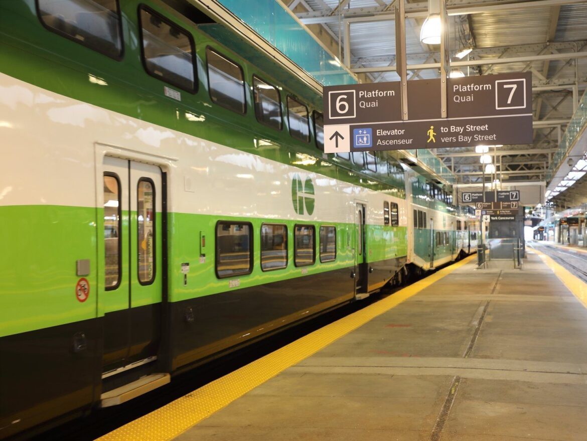 GO Train Passenger Holding Doors Open