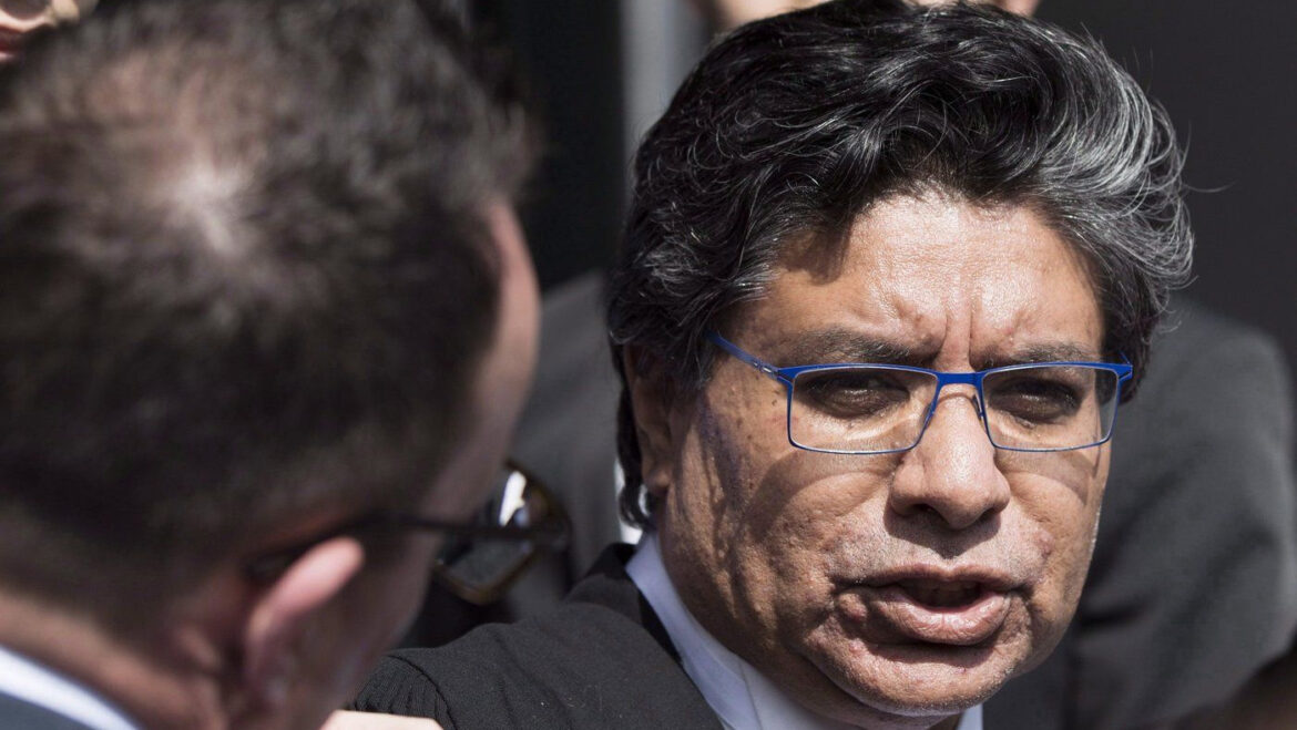 Ontario lawyer in black robe speaking outside courthouse during Deepak Paradkar bail hearing in Ryan Wedding extradition case