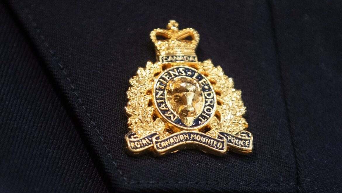 Close-up of a Royal Canadian Mounted Police (RCMP) badge on a uniform during an investigation in Sherwood Park, Alberta